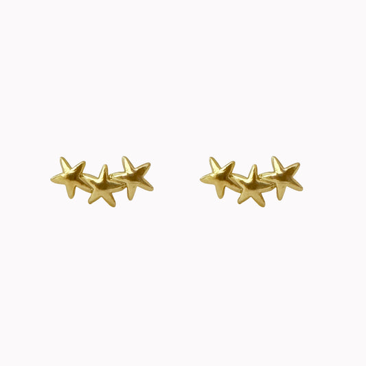 Gouden oor studs met drie sterretjes