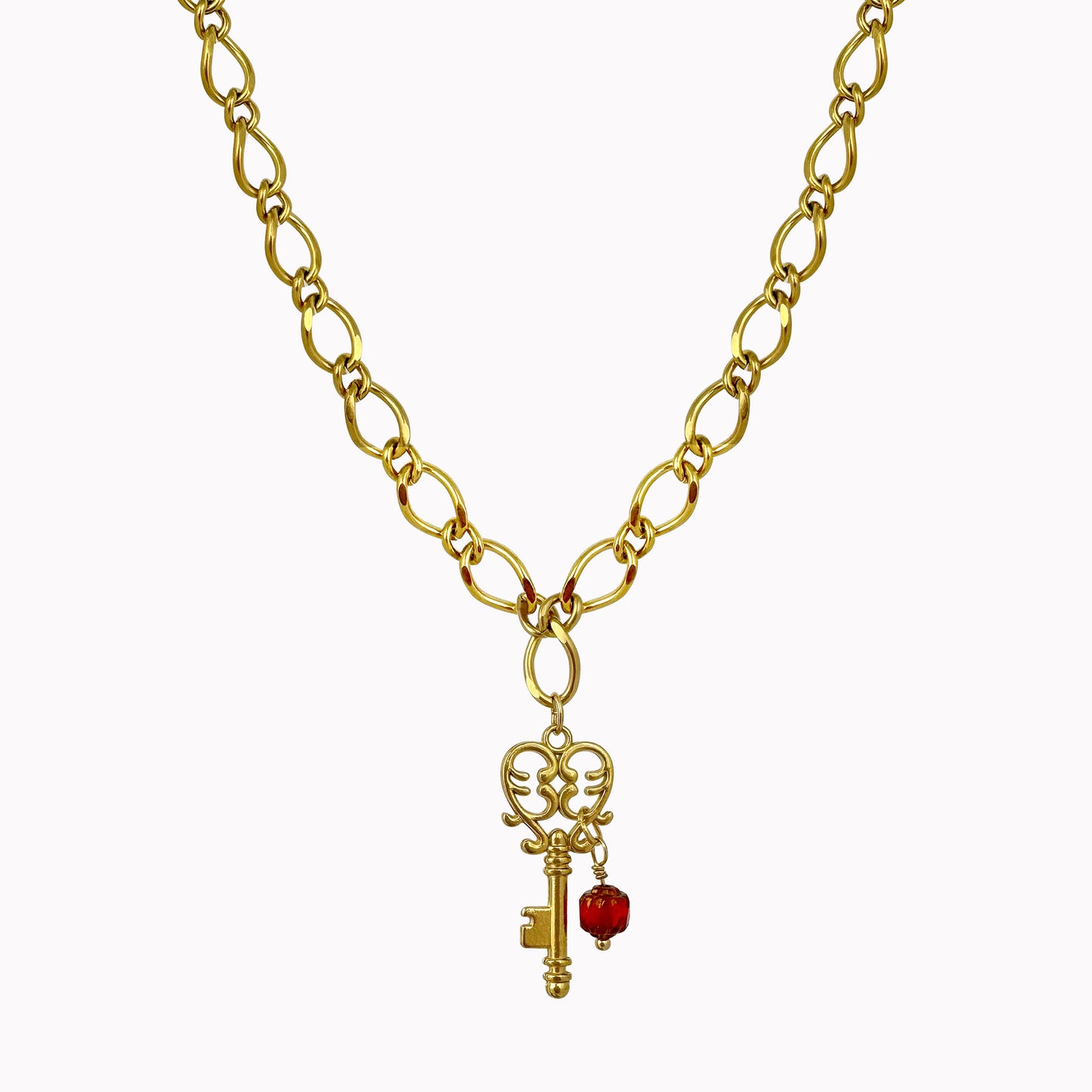 Gouden schakel ketting met bedel sleutel