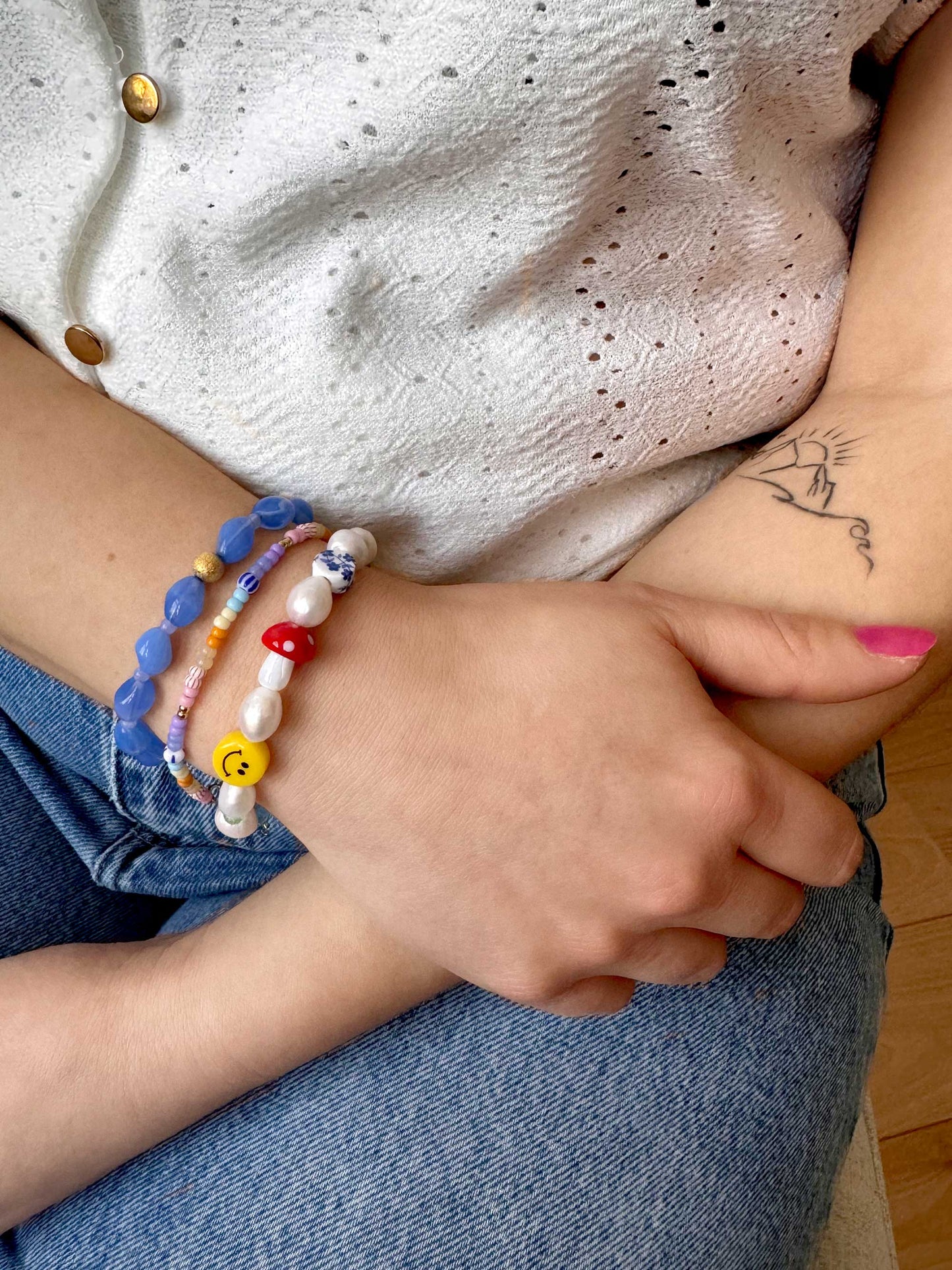 Statement armband met parels, smiley, paddenstoel en opvallende kralen