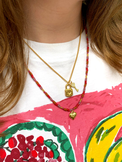 Roze kralen ketting met hartje