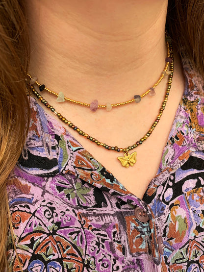 Gouden ketting met groene steentjes