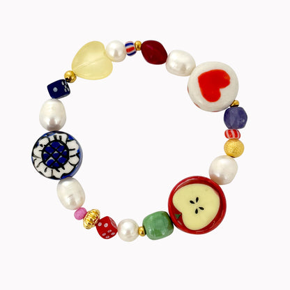 Statement armband met opvallende kralen appel hartje bloem