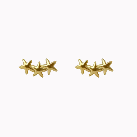 Gouden oor studs met drie sterretjes