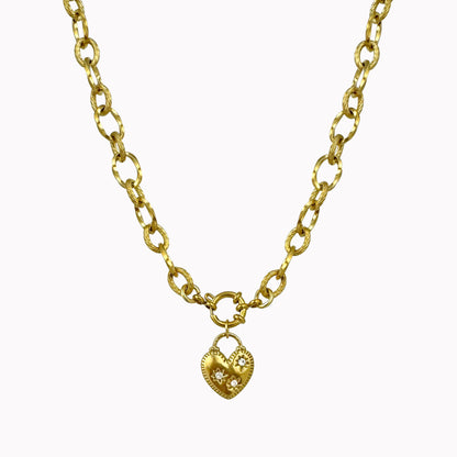 Gouden schakel ketting hart bedel met steentjes
