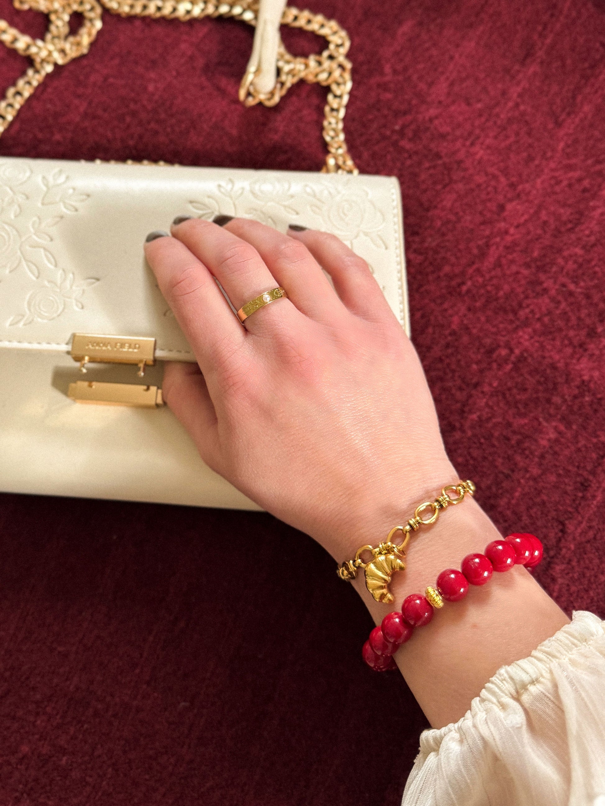 Schakelarmband met croissant bedel