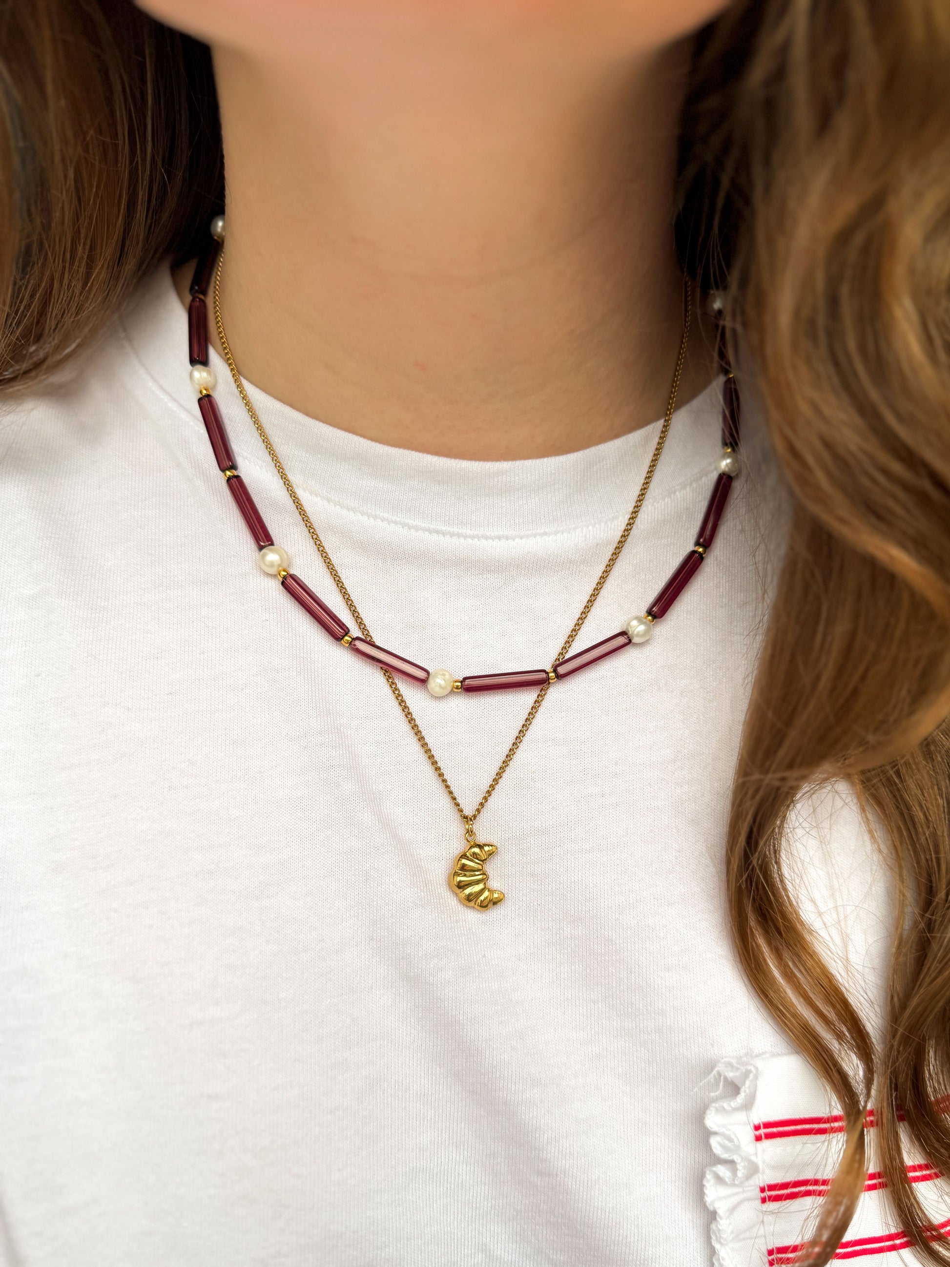 Gouden ketting met croissant bedel