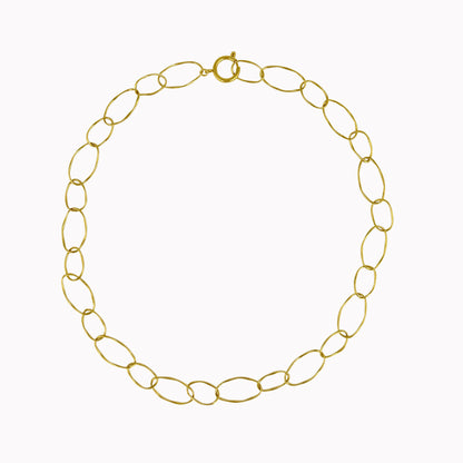 Gouden statement schakelketting met grote open ovale schakels in organische vormen.