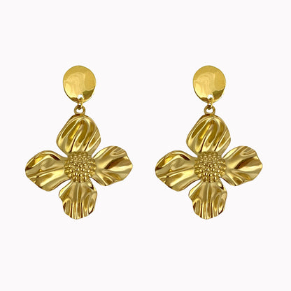 Gouden statement oorbellen met tropische bloem