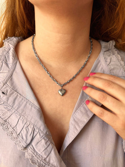Zilveren schakelketting met hartje