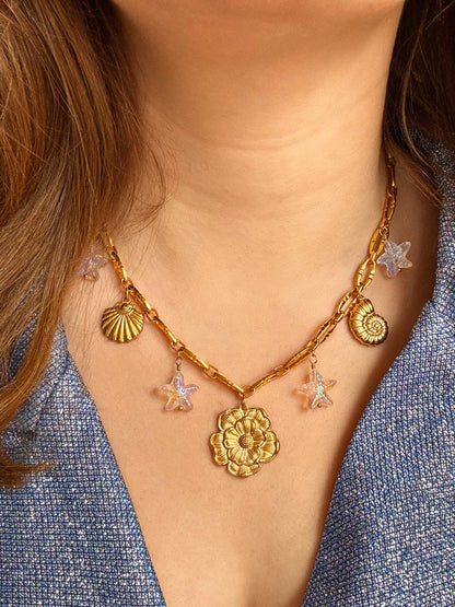 Schakelketting met verschillende schelpen bedels