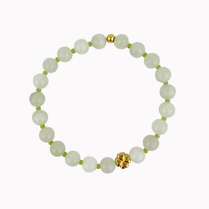 Groene kralen armband met gouden klavertje vier