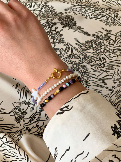 Paarse kralen armband met ster en slotje